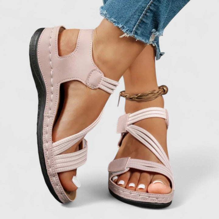 Orthopedic sandals for women, designed for plantar fasciitis, with three-arch support.