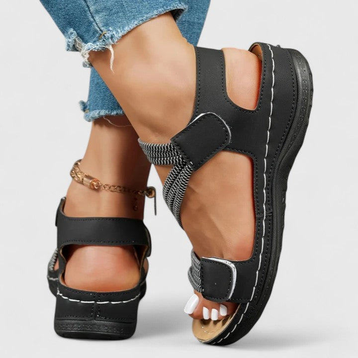 Supportive women's sandals with three-arch technology for orthopedic foot & heel pain relief.
