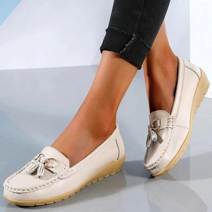 Sleek women's orthopedic slip-on loafers in a classic color, offering stylish comfort and foot support for daily wear.