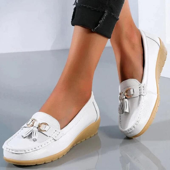 Durable sole on women's orthopedic slip-on loafers, providing superior foot support, comfort & stability.