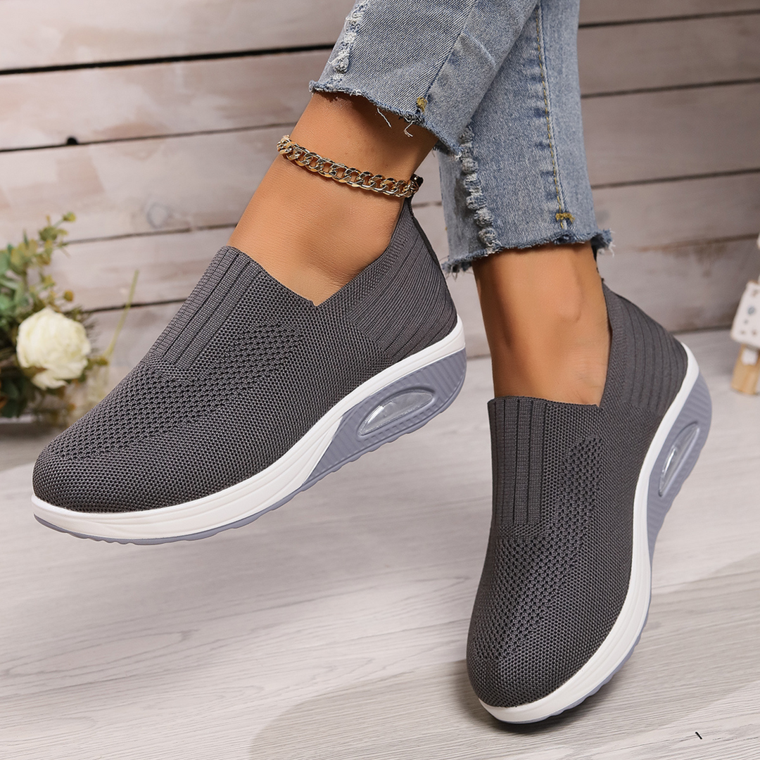 Stylish women's slip-on sneakers for ultimate comfort. Features orthopedic design, arch support & lightweight feel.