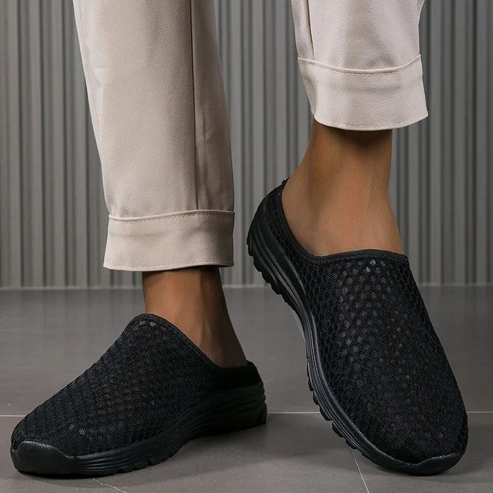 Supportive women's slip-on walking shoes with orthopedic arch support for all-day comfort.
