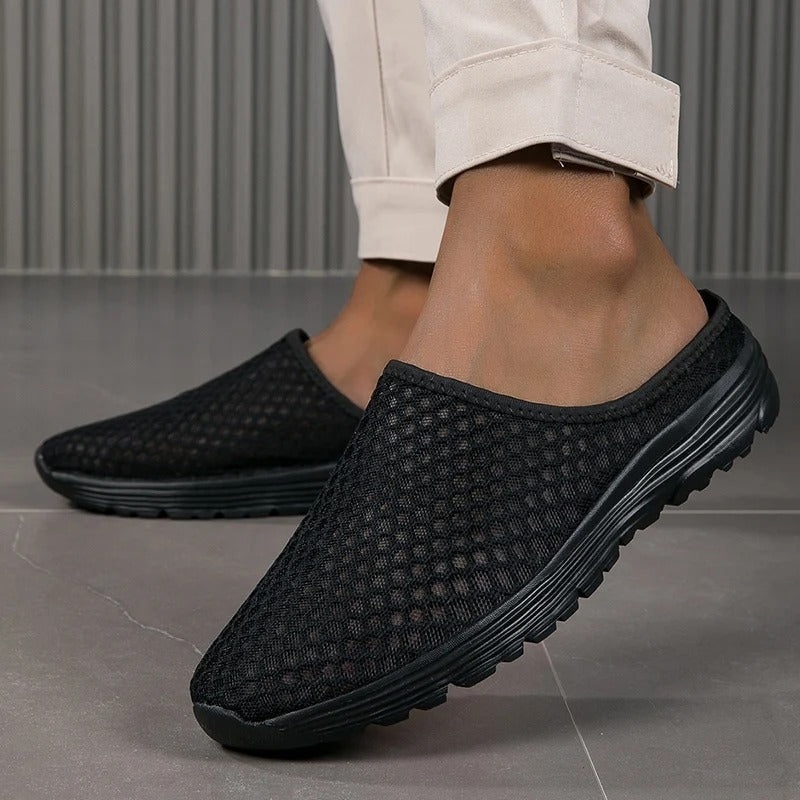 Black women's orthopedic slip-on sneakers, cushioned for comfortable everyday walking and arch support.