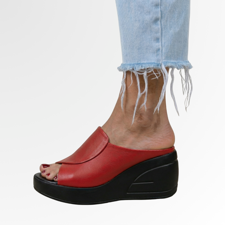 Lightweight women's slip-on wedge sandals. Orthopedic design ensures comfortable arch support for summer fashion.