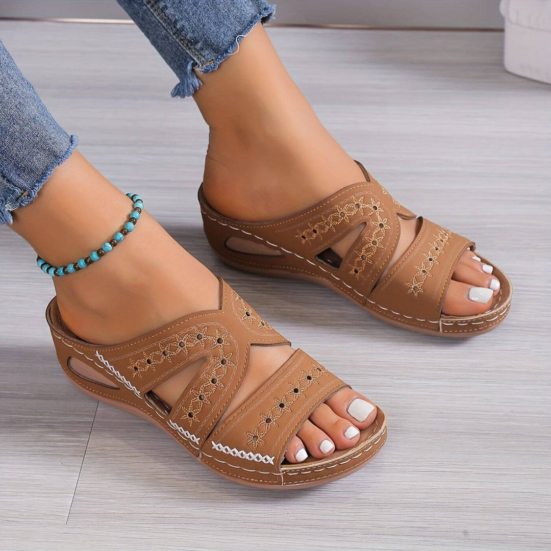 Comfortable women's orthopedic sandals providing pain relief, arch support, and secure slip-resistant walking.