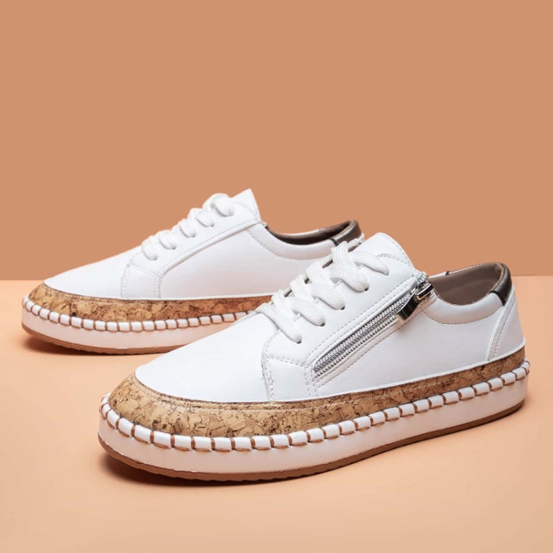 Stylish women's fashion sneakers featuring a convenient side zip & printed design. Ideal for casual footwear.