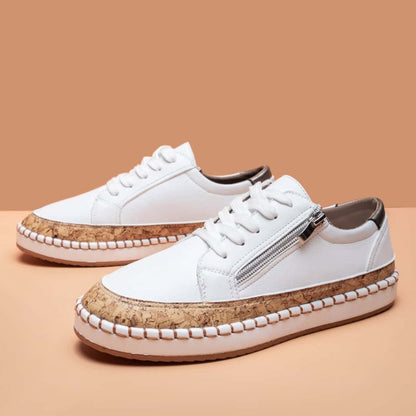 Stylish women's fashion sneakers featuring a convenient side zip & printed design. Ideal for casual footwear.