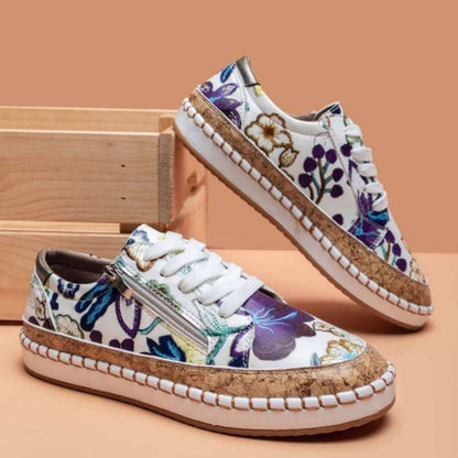 Women's comfort sneakers with easy side zip closure & stylish printed design. Great for casual wear.