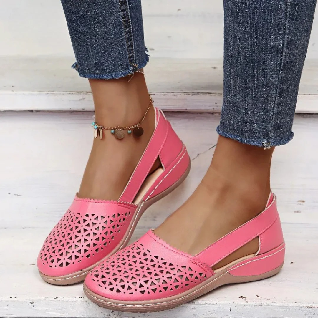 Elegant women's orthopedic spring shoes, slip-on style with breathable cutouts for fashionable all-day comfort.