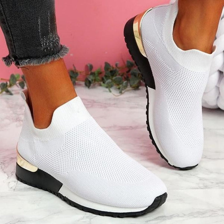Woman wearing supportive orthopedic sneakers, enjoying all-day comfort during a walk.