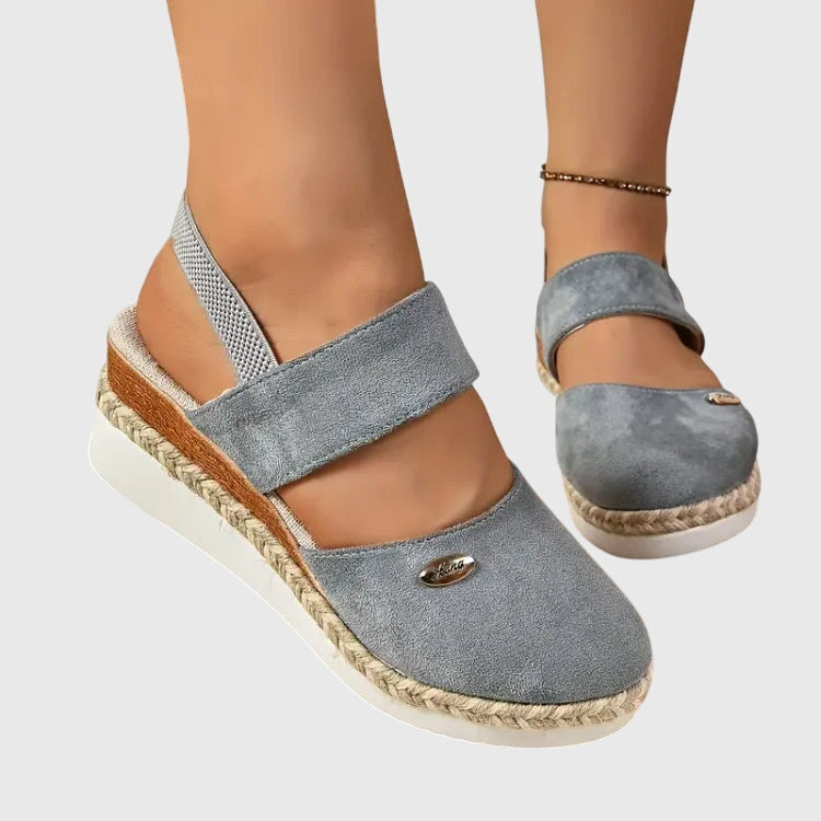 Slip-on women's orthopedic walking sandals with breathable design, cushioned sole, and arch support.