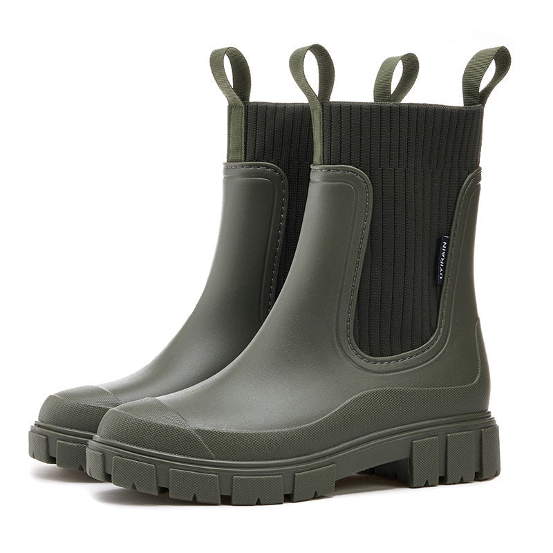 Close-up of a women's waterproof ankle boot, highlighting textured material & non-slip sole.
