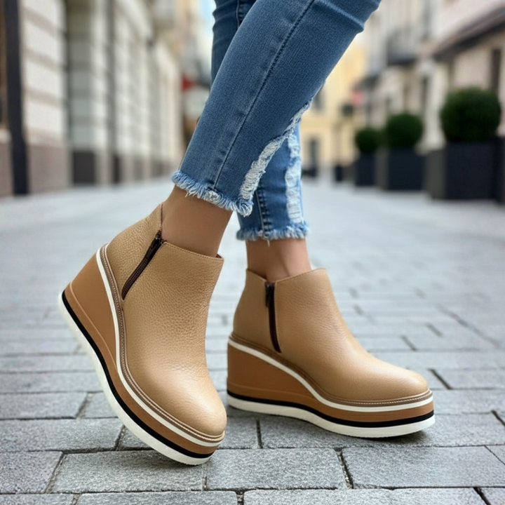 Full view of women's orthopedic wedge heel ankle boots, featuring a round toe, side zipper, and comfortable platform sole.