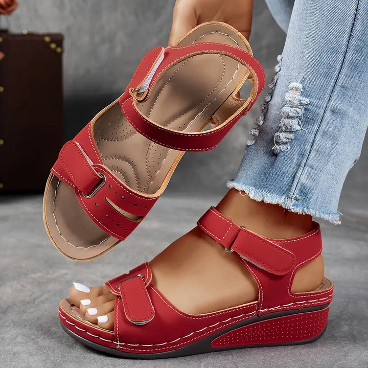 High comfort women's orthopedic sandals featuring a wedge heel, arch support, and adjustable strap.