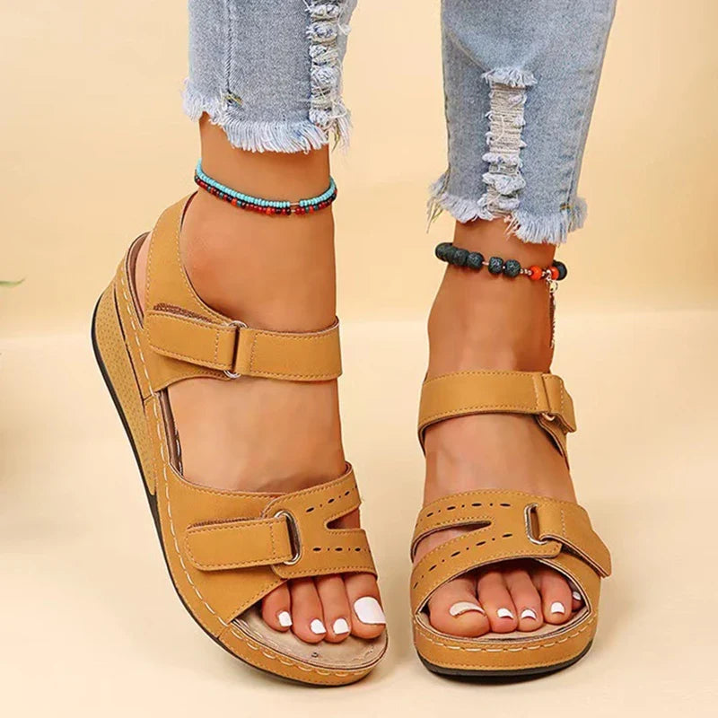 Close-up of women's orthopedic wedge sandals, highlighting ergonomic design and premium materials.