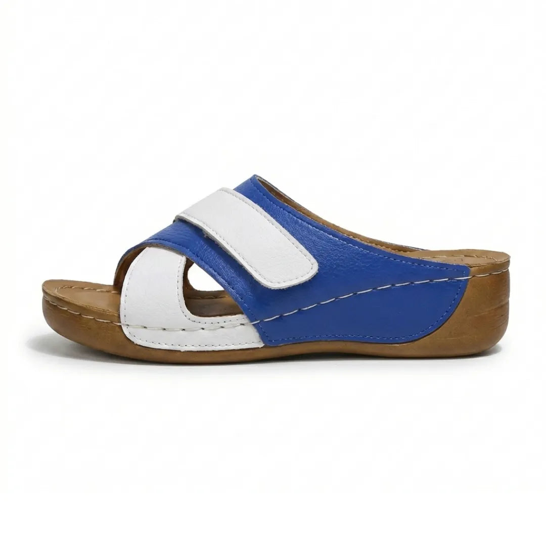 Women's comfort wedge sandals with cushioned sole and adjustable fit.