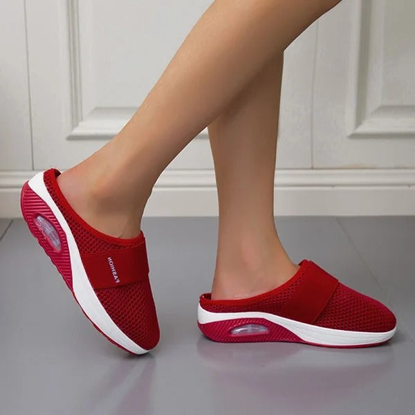 Close-up of supportive arch in women's orthopedic wedge sandals for enhanced foot comfort & stability.