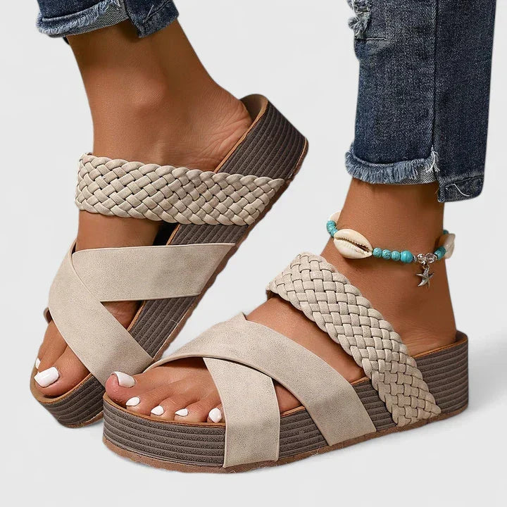 Slip-on women's orthopedic wedge sandals featuring a stylish woven crossover strap for all-day comfort.