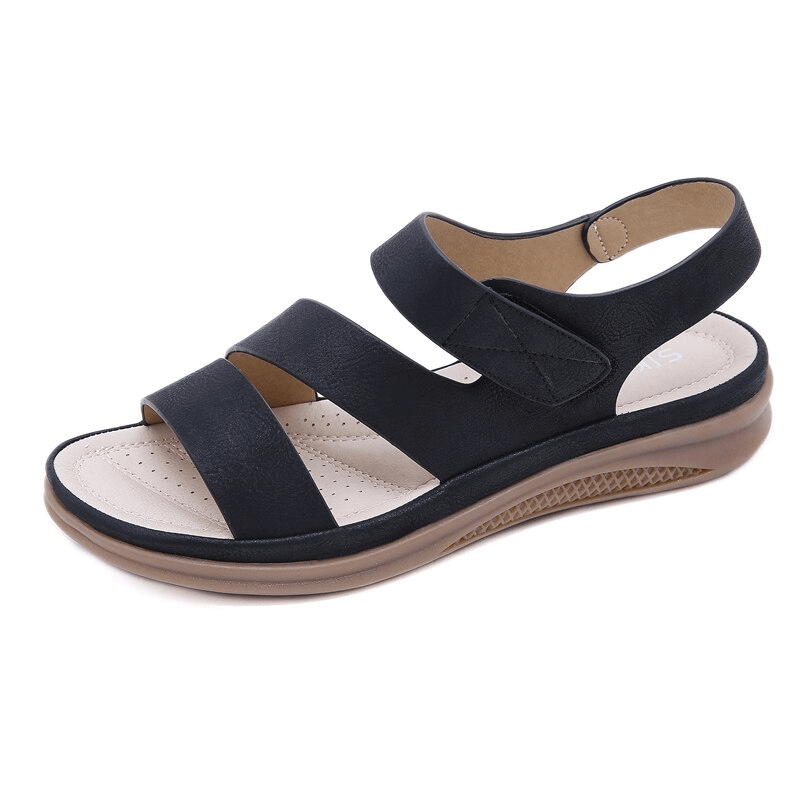 Women's supportive wedge sandals in a neutral tone, featuring orthopedic arch support.