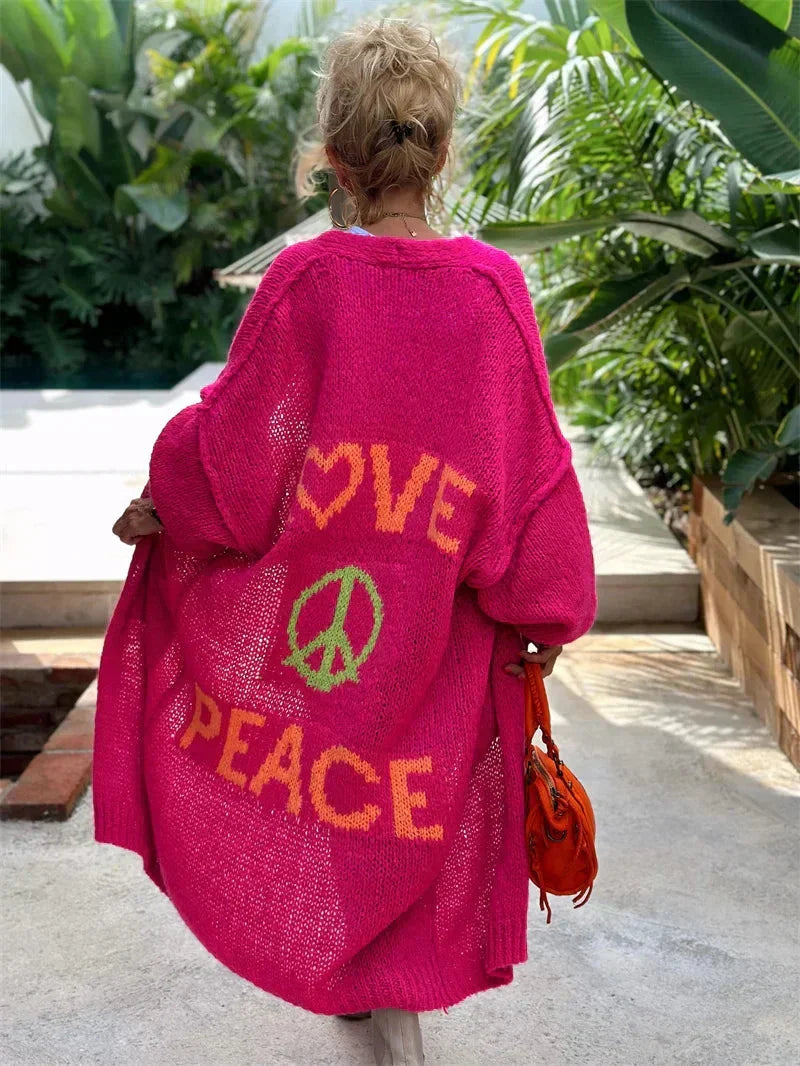 Women's oversized bohemian knit cardigan, long with vibrant peace & love design.