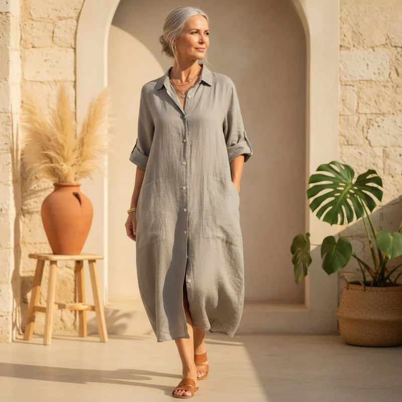 Women's oversized button-down midi shirt dress with pockets. Casual, relaxed fit for summer fashion.