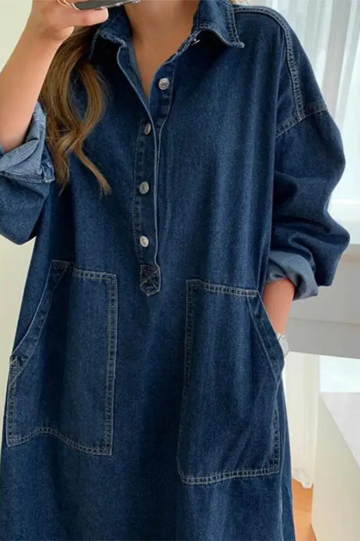 Stylish women's oversized button-front maxi dress. Features a relaxed fit, long design, and essential side pockets for daily wear.