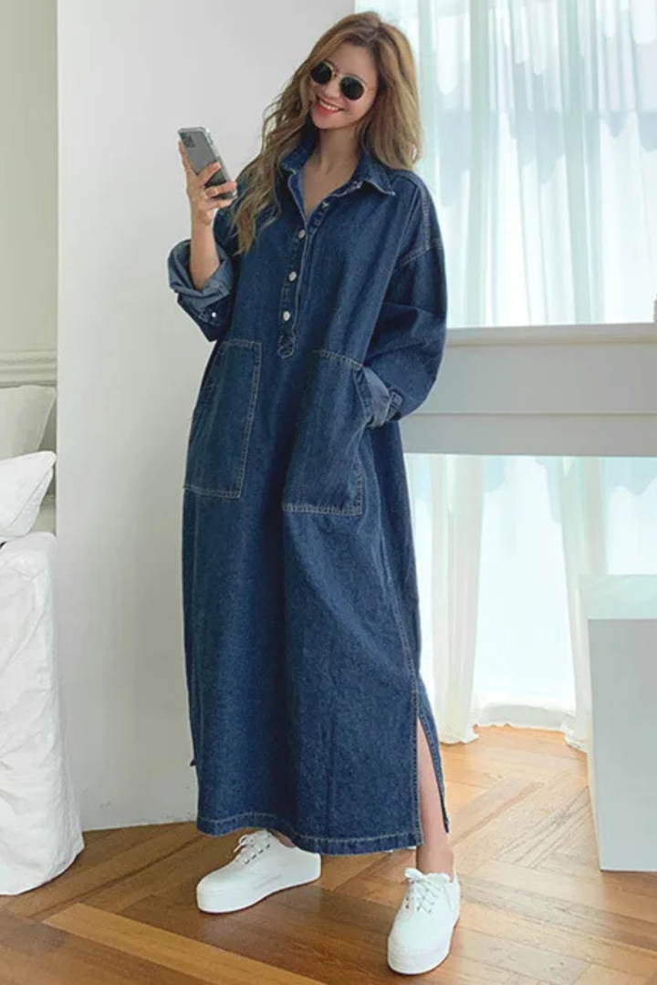 Elegant women's oversized maxi dress. Features a chic button-front, comfortable long design, and convenient pockets for style.