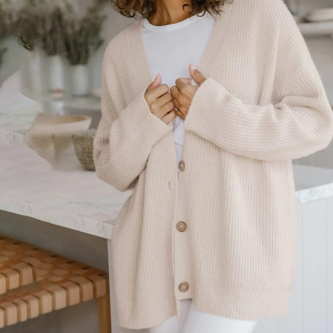 Chic v-neck button-up women's cardigan, an oversized sweater for layering comfort.