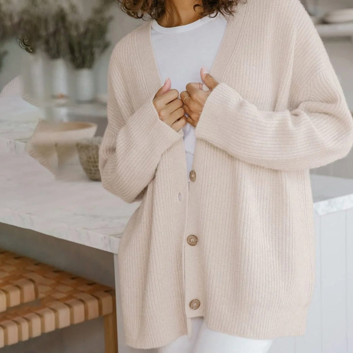 Chic v-neck button-up women's cardigan, an oversized sweater for layering comfort.