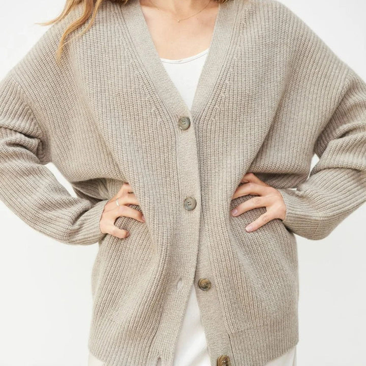 Women's cozy knit oversized cardigan with buttons, perfect for relaxed casual wear.