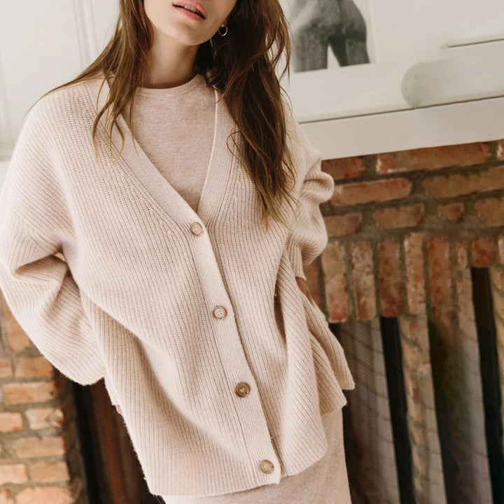 Soft women's oversized button-up cardigan, a long sleeve v-neck cozy knit sweater.