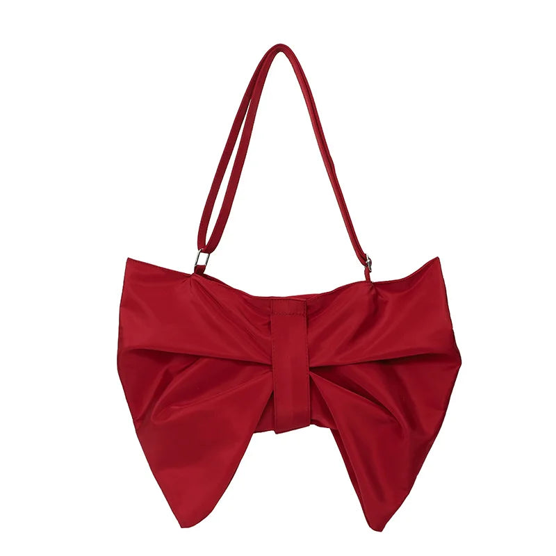 Large women's handbag: oversized canvas tote with a distinctive, stylish bow accent. Fashion accessory.