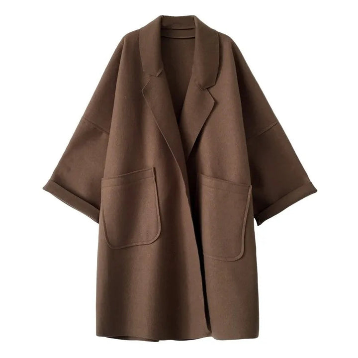 Women's oversized elegant trench coat for business casual wear. Stylish and versatile fall/winter outerwear.
