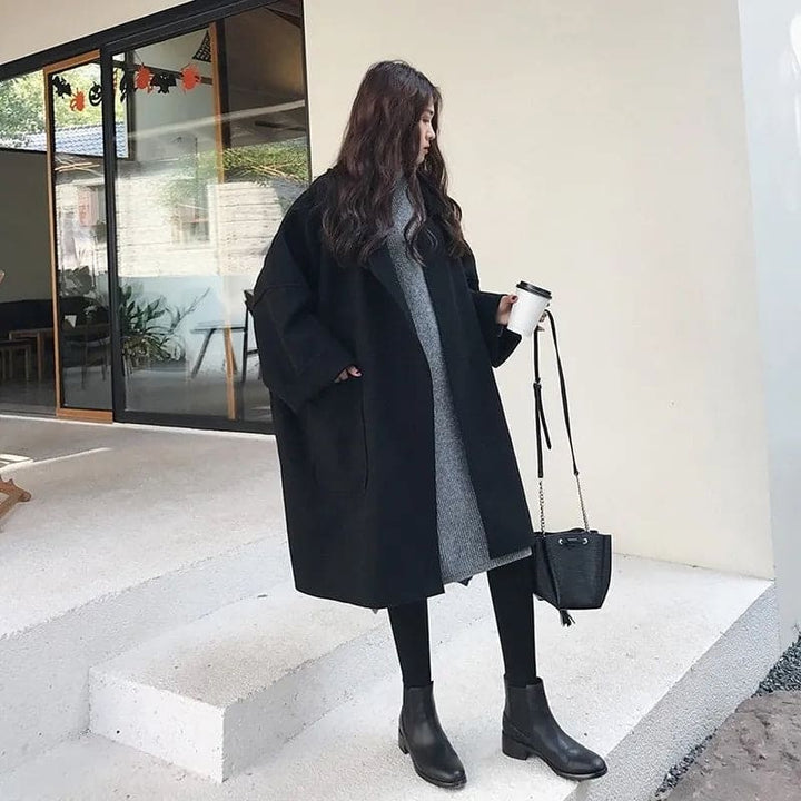 Classic oversized women's trench coat, offering an elegant and comfortable fit for fall & winter outerwear.