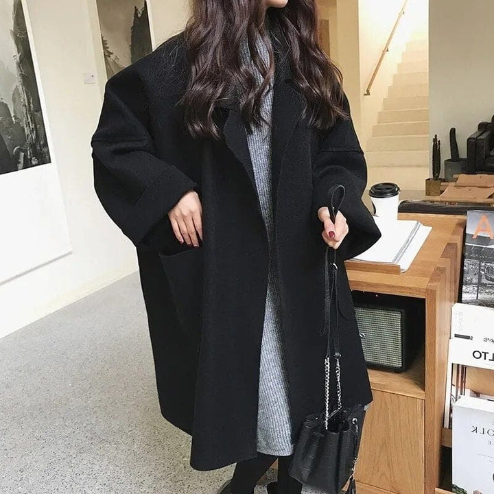 Versatile women's oversized trench coat, blending elegant style with business casual comfort for fall outerwear.
