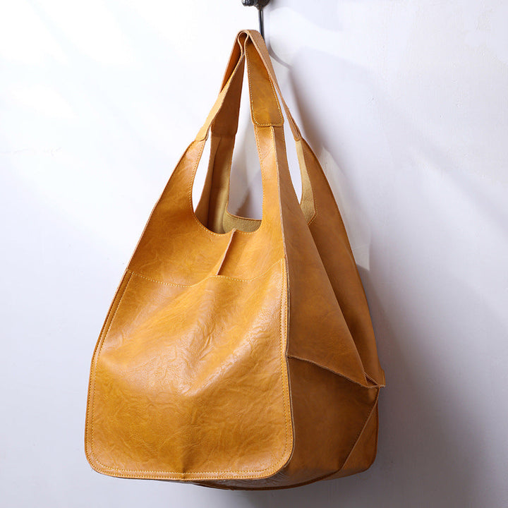 Practical women's oversized shoulder bag, a large everyday tote offering ample space for all necessities.