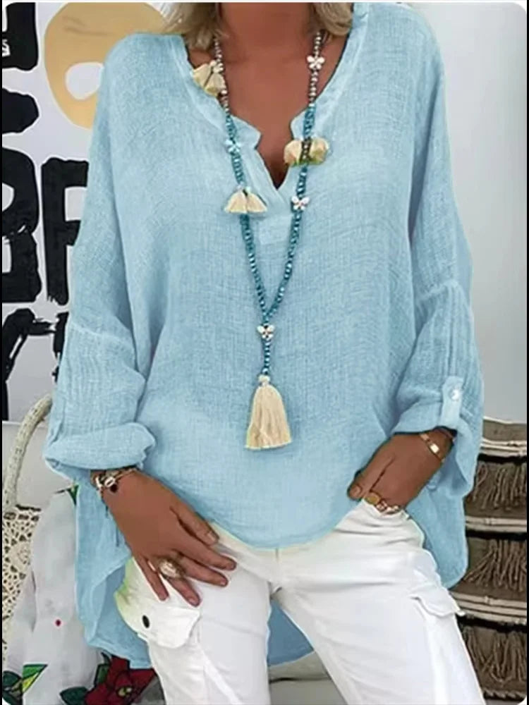 Women's oversized flowy blouse, perfect for chic casual wear or a versatile summer top.