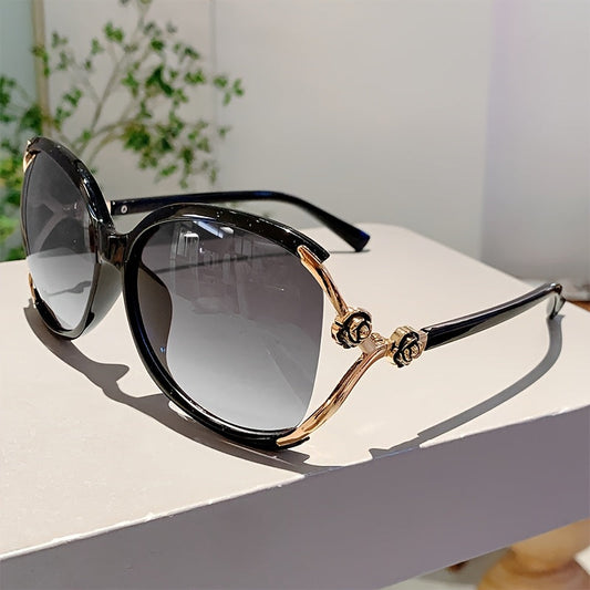 Women's oversized gradient sunglasses with unique rose detail, black acetate frame, UV400 protection.