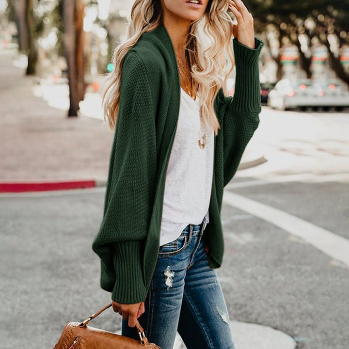 Women's oversized knit cardigan in soft fabric; perfect for cozy fall & winter fashion.