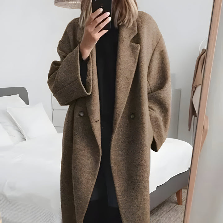 Warm women's oversized winter jacket with a chic lapel collar, designed for ultimate comfort in cold weather outerwear.