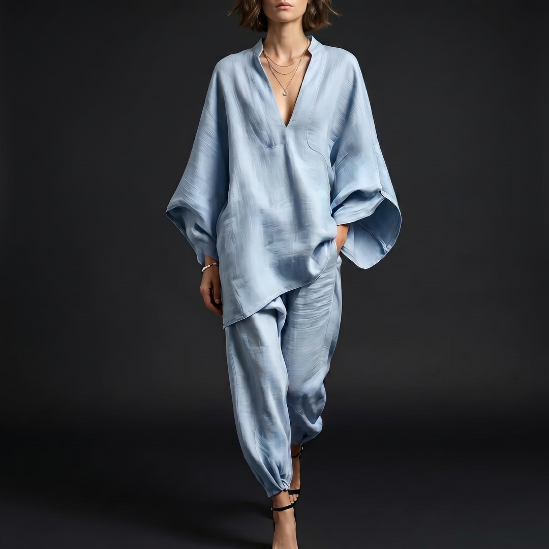 Women's oversized linen blend tunic with stylish batwing sleeves. Perfect for casual summer comfort.