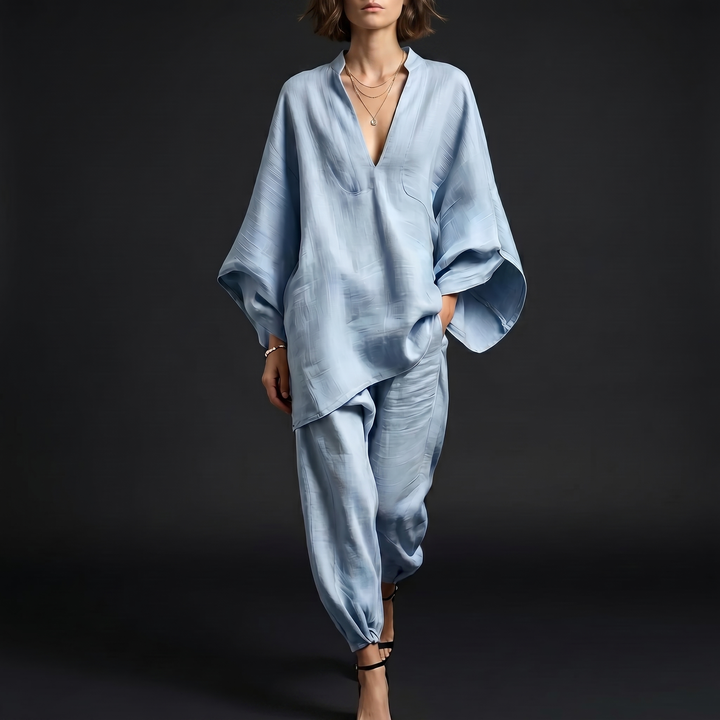 Women's oversized linen blend tunic with stylish batwing sleeves. Perfect for casual summer comfort.