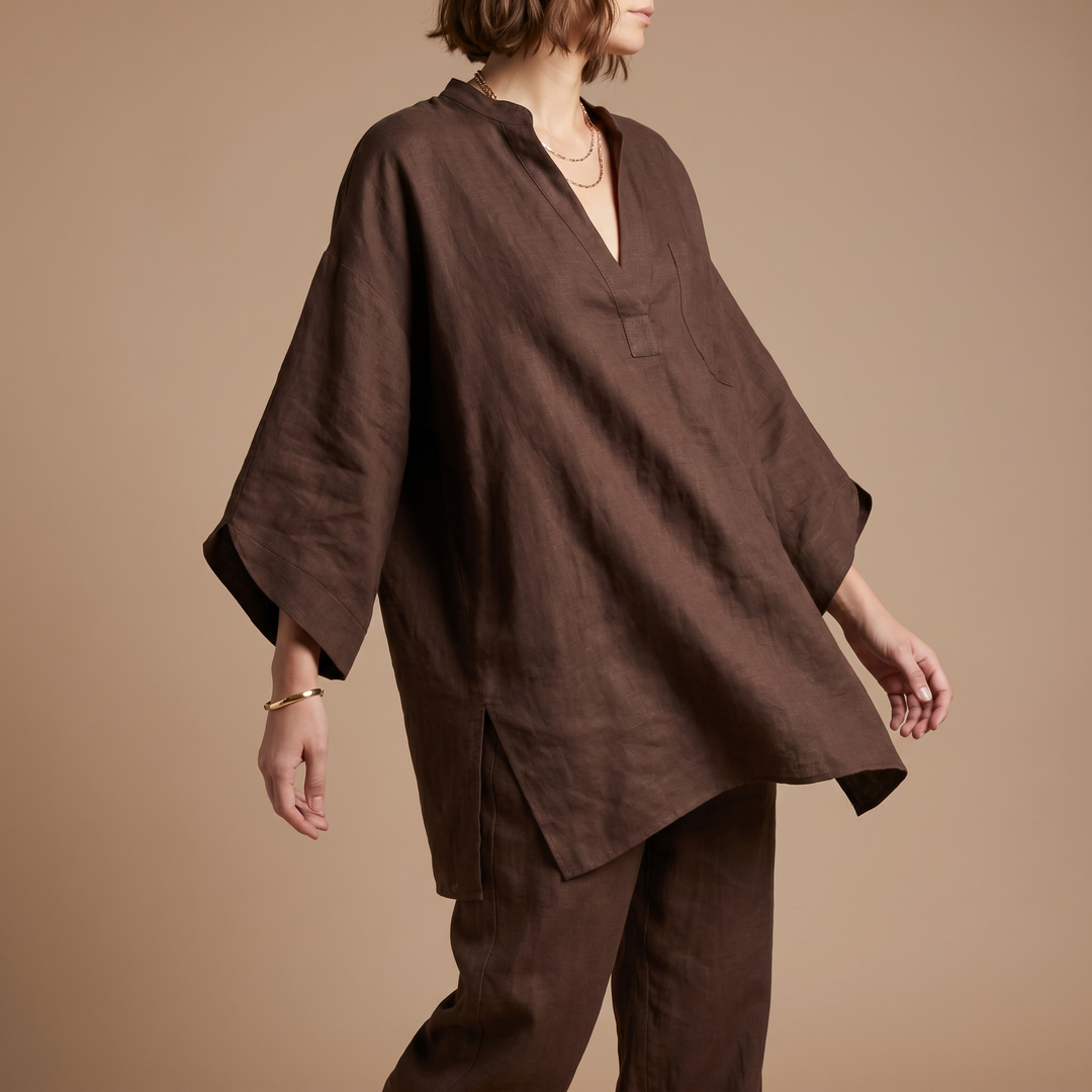 Stylish women's oversized linen blend tunic, styled with batwing sleeves, ideal for chic summer outfits.