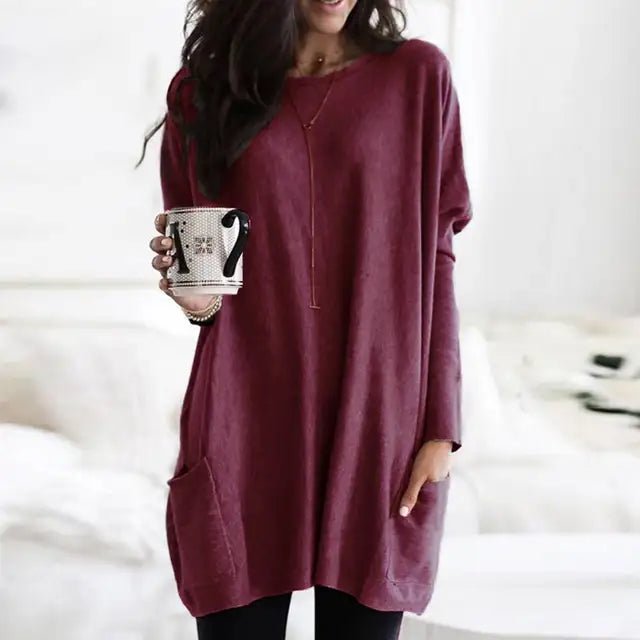 Women's oversized long sleeve tunic top with pockets. Casual, comfortable, and versatile for everyday style.