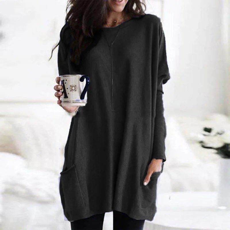 Oversized long sleeve women's tunic top, featuring a relaxed fit and practical pockets for casual comfort.