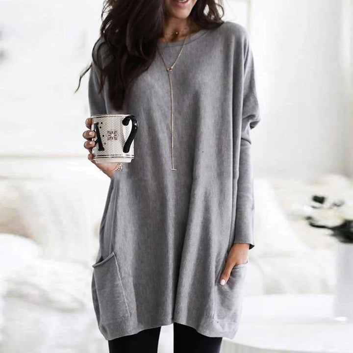 Casual women's oversized long sleeve tunic with pockets, a comfortable and versatile top for daily outfits.