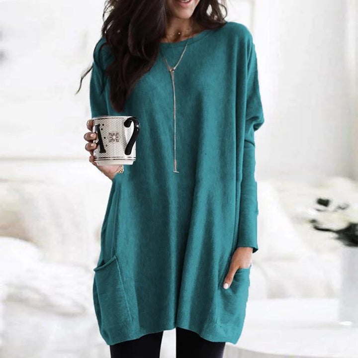 Women's oversized long sleeve tunic top with pockets, perfect as a comfortable layering piece or casual wear.