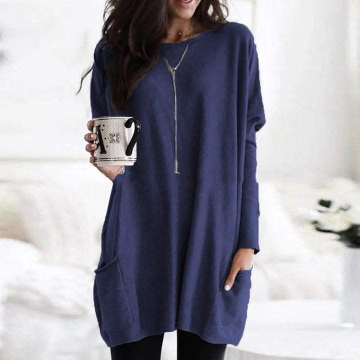 Relaxed fit women's long sleeve pocket tunic top, ideal for comfortable casual and versatile layering.