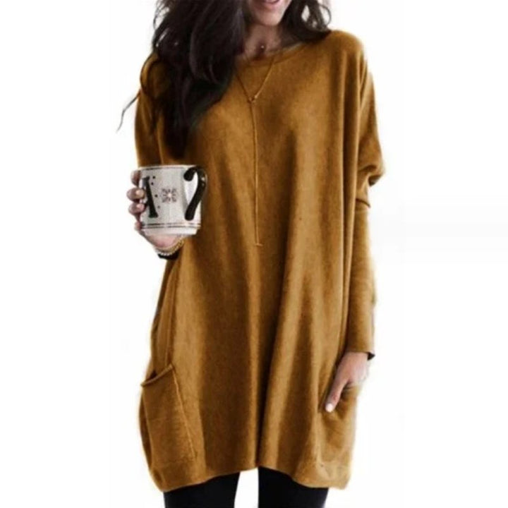 Trendy oversized long sleeve women's tunic, featuring crew neck & useful pockets for comfortable casual wear.