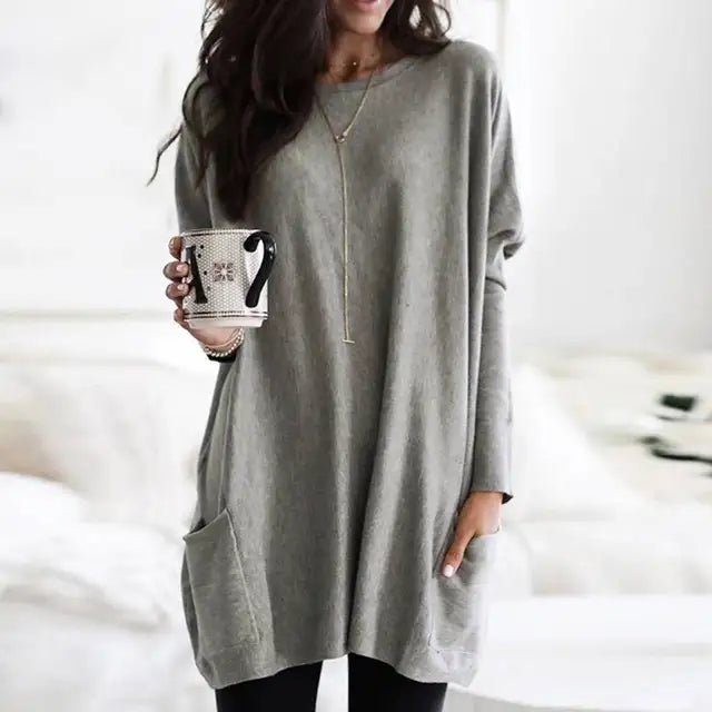 Oversized long sleeve tunic top for women, featuring practical pockets & a relaxed fit. Great for casual wear.